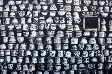 PAPHOS, CYPRUS - APRIL 19, 2016: Closeup of street graffiti art murals depicting black-and-white cups in old center of Paphos,Cyprus,Europeのeditorial素材