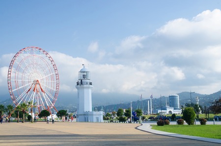 BATUMI, GEORGIA - OCTOBER 7: Ferris wheel and old lighthouse situated in Miracle Park at city seafront on October 7, 2016 in Batumi, Georgia.のeditorial素材