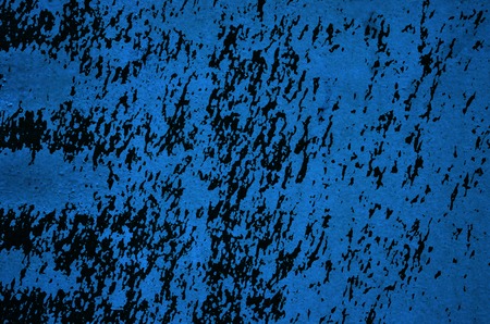 Old urban blue wall background with black paint splashes - texture for your grunge design