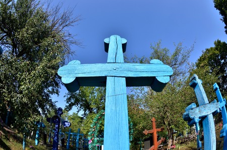 Old blue orthodox Christian crosses in a small abandoned ukrainian villageの写真素材