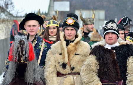 Vashkivtsi,Bukovina,Ukraine - January 14, 2019:Young men dressed as viking warriors with horned helmets and animal skins at traditional Pereberia (means change clothes) carnival.Its a festival held on Old New Years Day and Malankaのeditorial素材