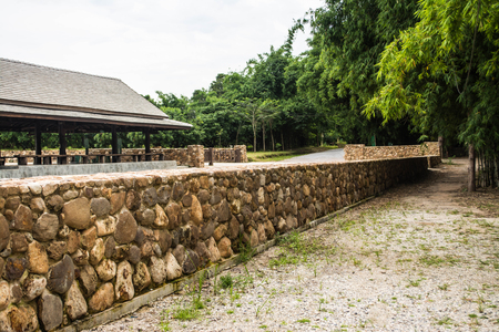 A long, low wall built with bricks Beautifully arranged in Chiang Rai province of Thailandの写真素材