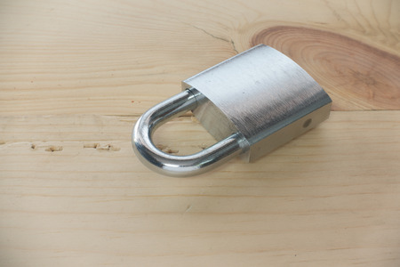 check-lock on wooden background
