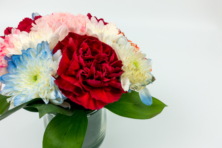 Carnation small vase with other flowers. on white backgroundの写真素材