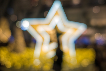 Christmas lights blurred starry night among the people.の写真素材