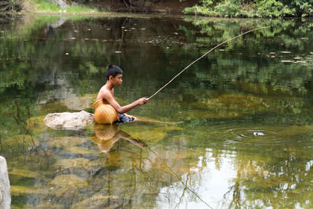 2017 October 1 Ratchaburi, Thailand. Woman potter checking pot in pottery workshop.のeditorial素材