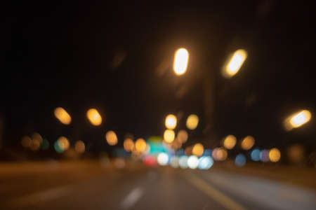 Multicolored defocused bokeh blurry lights. Abstract blur defocus bokeh background of car light glowing or Illuminate at night as Citylife lifestyle Concept.の写真素材