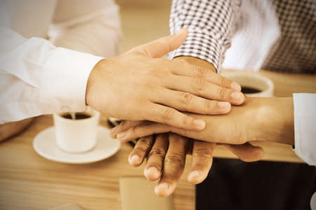 Close up Businessmen put their hands together to work together. Concept Teamwork.の写真素材