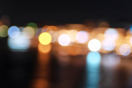 Abstract colorful blurred bokeh soft bright circle light on nightlife at river. Wallpaper and...
