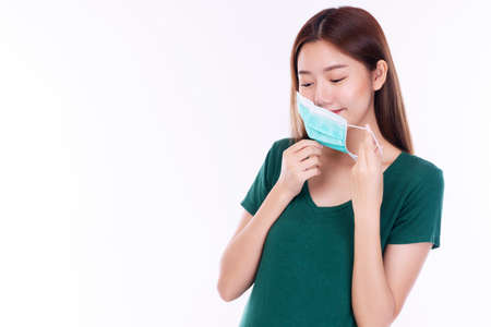 Student young woman wearing safety medical mask protection from inhaling airborne bacteria or virus...