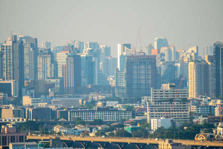Bangkok, THAILAND - JANUARY 4,2020 : Low visibility city view in evening with dangerous haze and fog toxic haze effect respiratory bad healthy. Concept of Pollution air pollution dust PM2.5 Unhealthy.のeditorial素材