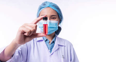 Hand of young woman doctor wear uniform white clothes and medical mask protection virus disease on...