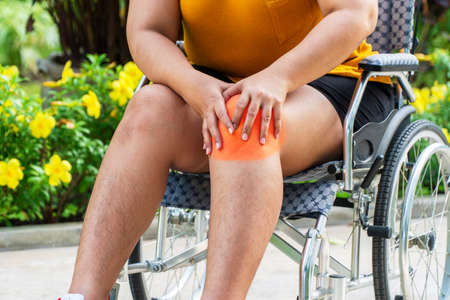 Problem knee pain stressed with overweight or obesity. Hand of fat woman touching disease her knee...