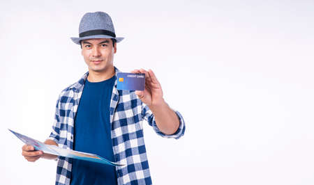 Payment financial booking online concept. Traveler handsome young man wear blue casual with hat...