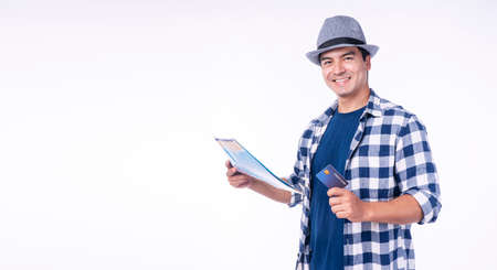 Traveler handsome young man wear blue casual with hat holding map showing mock up credit card in own...