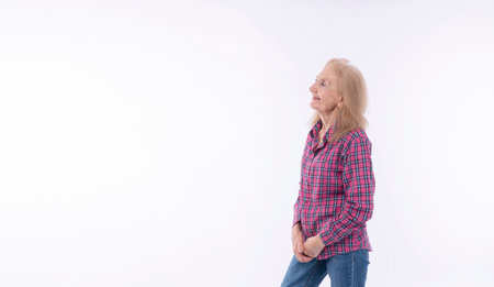 Positive confident 70s healthy grandmother thinking get idea or something looking copy space over...