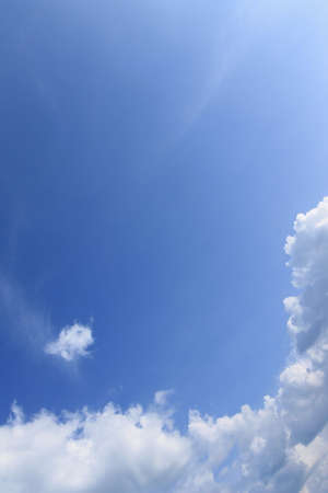 White clouds against the clear sky
