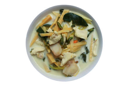 Chicken in coconut milk and galangal on white backgroundの写真素材