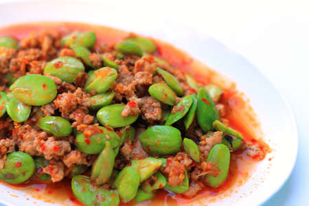 Stir-fried of Spicy Pork with Stink Beans on white backgroundの写真素材
