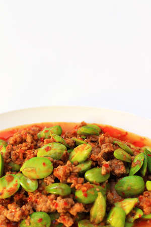 Stir-fried of Spicy Pork with Stink Beans on white backgroundの写真素材