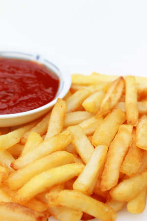 French Fries in white plate with tomato sauceの写真素材