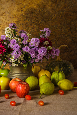 Still life with Fruits were placed together with a vase of flowers beautifully.の写真素材