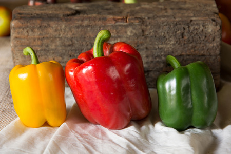 Still life with peppers, herbs, vegetables and fruits as an ingredient in cooking.