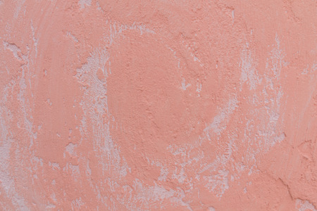 Pink plaster wall texture for use as background.