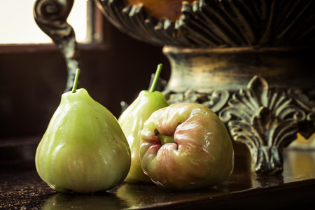 still life with rose apple or chompu on woodenの写真素材