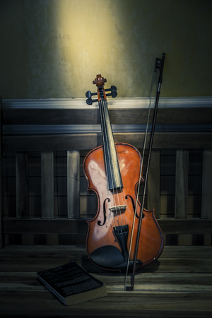 Still life of violin on old books style with space for textの写真素材