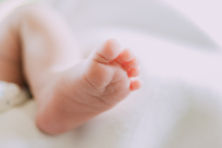 Photos closely at the foot of tiny baby be cuteの写真素材