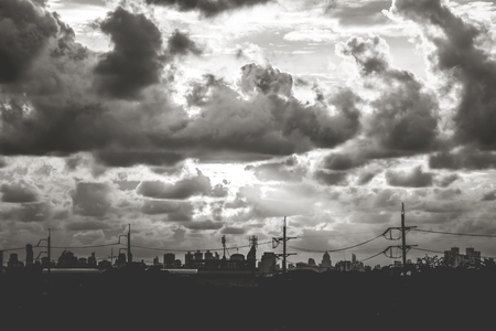 Romantic sunset sky with fluffy clouds and beautiful heavy weather landscape for use as background images and illustrations in the color tone black and whiteの写真素材