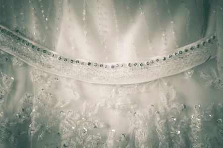Details of the bride dress fabric and beautiful embroidery wedding concept used as a background for illustrations and text.の写真素材