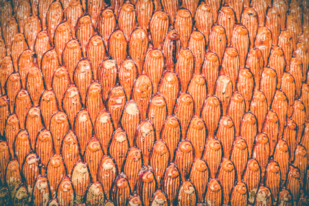 The background image of the orange clay tiles is used as an illustration of the decorative work.