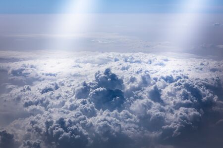 White cloud clusters in blue sky and sunshine are beautiful scenery. Use as for illustrations and...