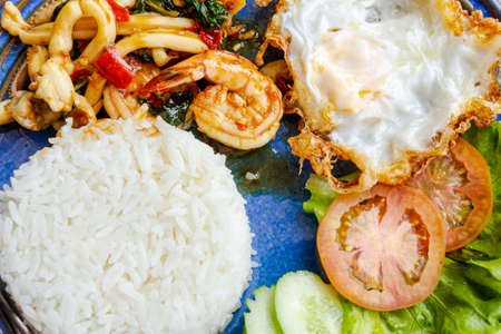 Fried rice with shrimp leaves and squid, fried egg is a dish of Thailand.の写真素材