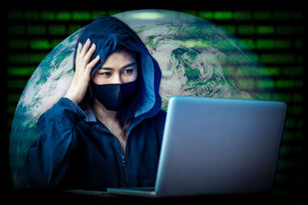 Professional hacker women Stealing data from online computer systems By releasing viruses into the system By using laptops the concept of malware and hacker Elements of this image furnished by NASAの写真素材