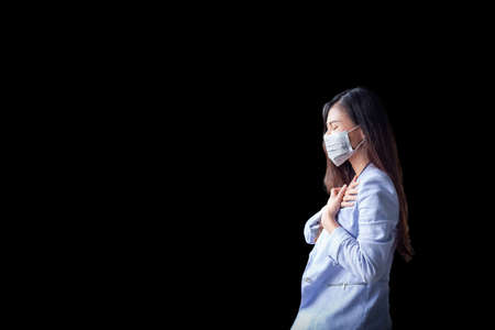 Women who have a cough and are sick with a flu infection,  covid-19, coronavirus, therefore have to use masks to cover the mouth and nose.の写真素材