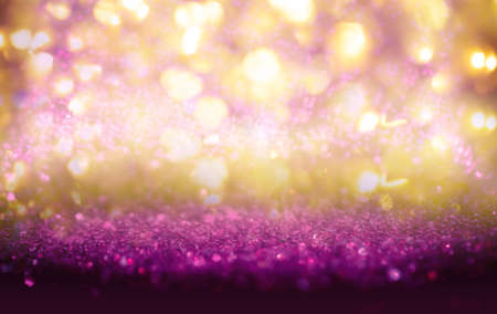 Purple and Gold glitter vintage lights background defocused for festivals and celebrationsの写真素材