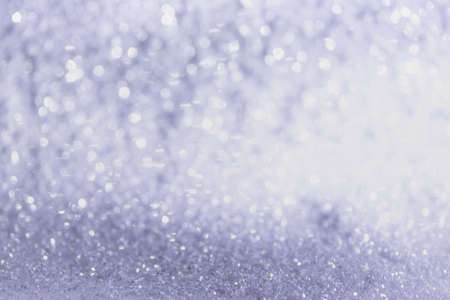 white, silver glitter vintage lights background defocused for festivals and celebrationsの写真素材