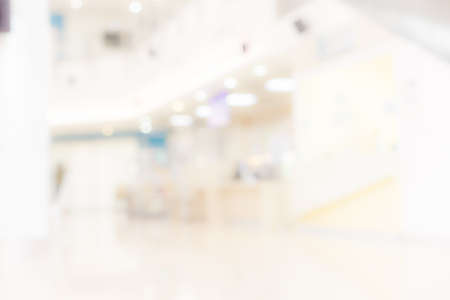Blur light background at shop in mall for business background, Abstract blurry bokeh at interior hallwayの写真素材