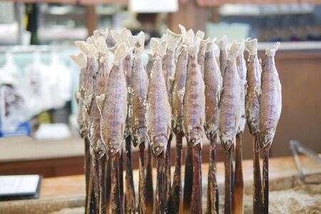 Traditional japanese style grilled fish Ayu stick with salt in local restaurant at Takayama, Japanの写真素材