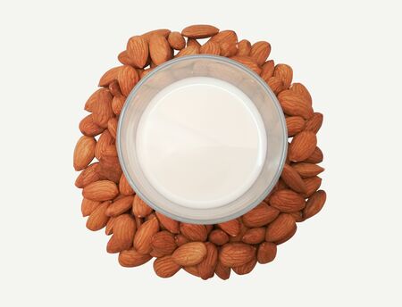 almond milk and almonds on white background, top view. isolatedの写真素材