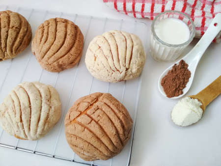 Homemade freshly baked sweet bread. Mexican bakery chocolate and vanilla shells and some ingredients