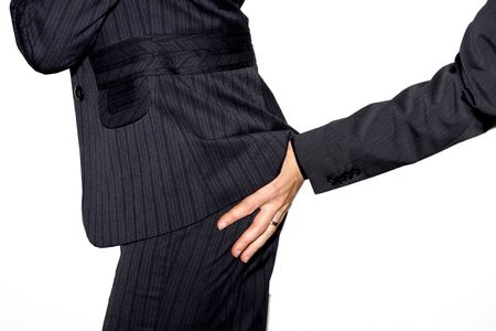 Touching a business womans buttの写真素材