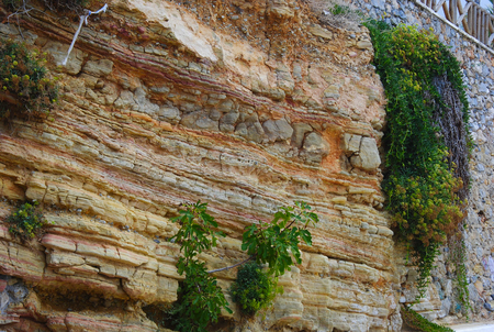 different layers of soil in a wall of bricks in Sisi, Crete, Greeceの写真素材