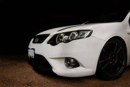 Front of White Ford Falcon XR6 FG car in the dark. Photo taken in Perth, Western Australiaの写真素材