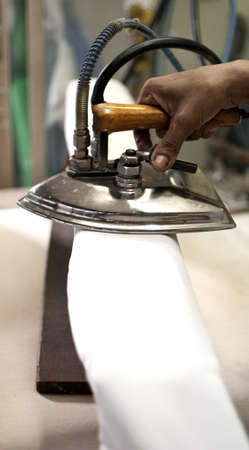 Iron on white clothesの写真素材