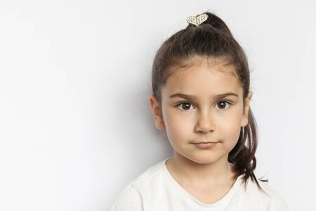 Happy smiling child girl on white background