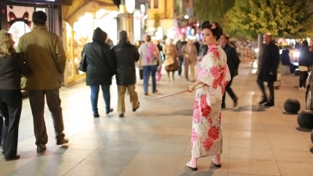 ISTANBUL, TURKEY - JANUARY 2013: Japanese geisha samurai with sword outside at nightのeditorial素材